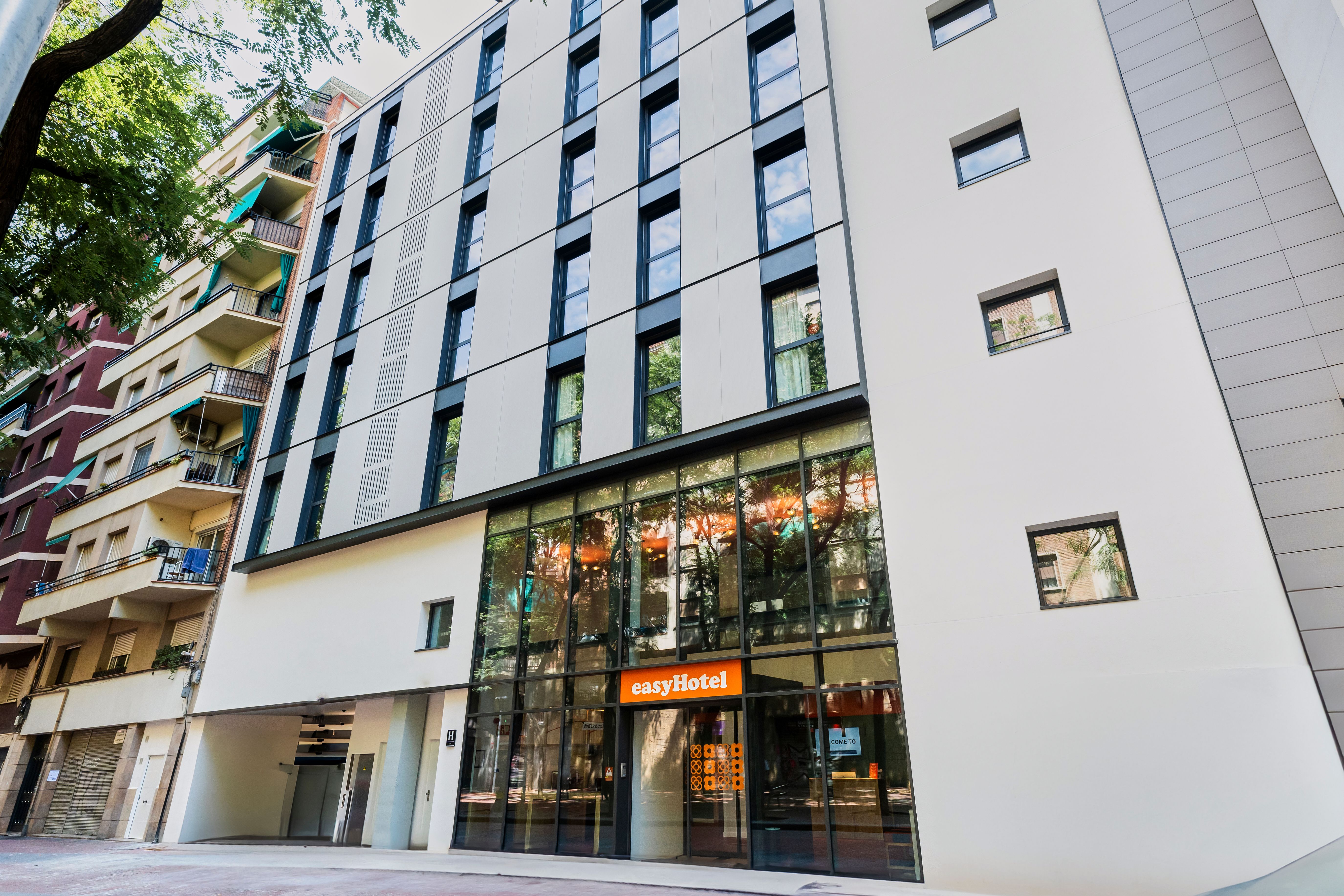easyHotel Barcelona La Sagrera exterior, showing a modern, multi-story building with numerous windows and the easyHotel logo above the entrance.